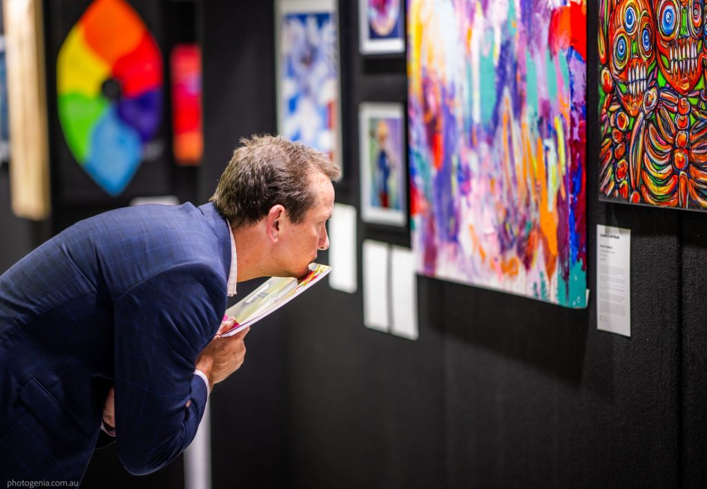 RFQ Recovered Futures Art Exhibition man reading description