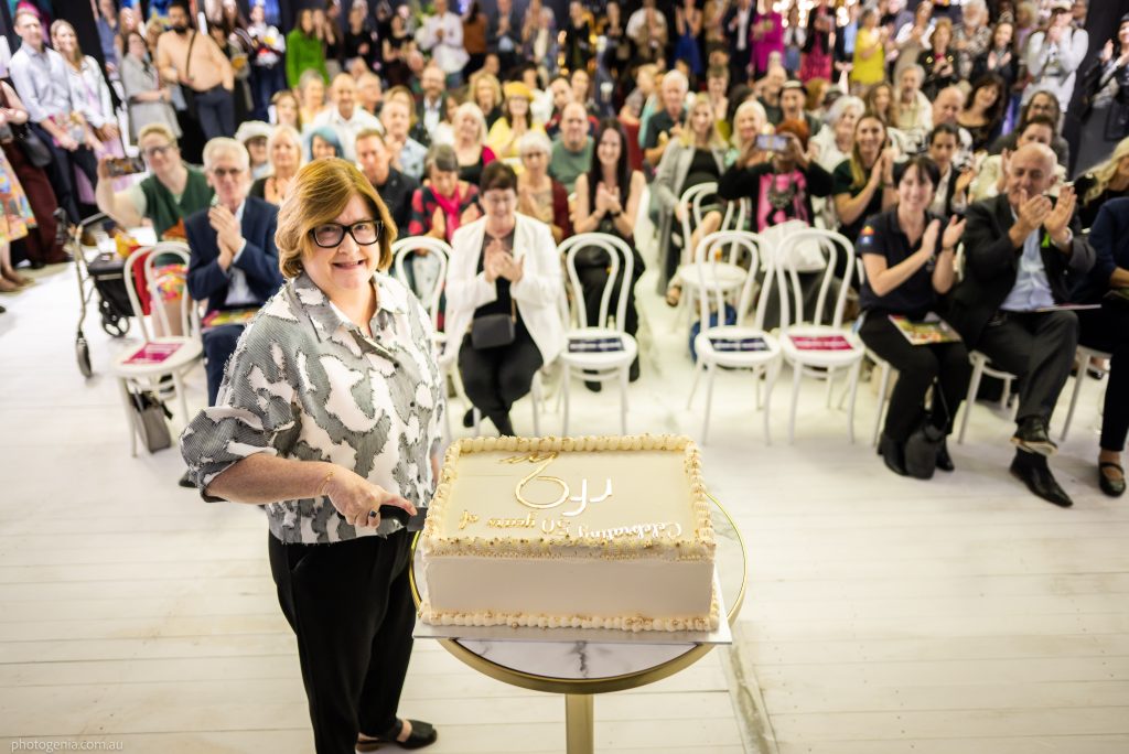Rhonda cutting the 50 year cake